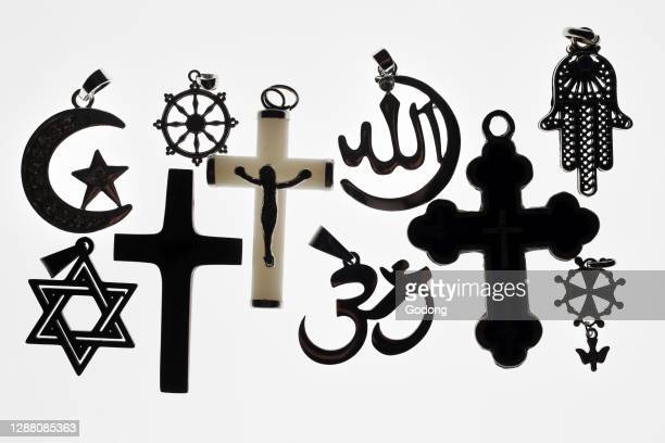 Religious symbols. Christianity, Islam, Judaism, Buddhism and Hinduism. Interfaith dialogue. France. (Photo by: Fred de Noyelle/Godong/Universal Images Group via Getty Images)