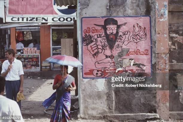 An anti-JVP government propaganda poster portraying Marxist politician Rohana Wijeweera as a tool of the CIA (Central Intelligence Agency) and the RAW (Research and Analysis Wing), Sri Lanka, August 1989. (Photo by Robert Nickelsberg/Getty Images)