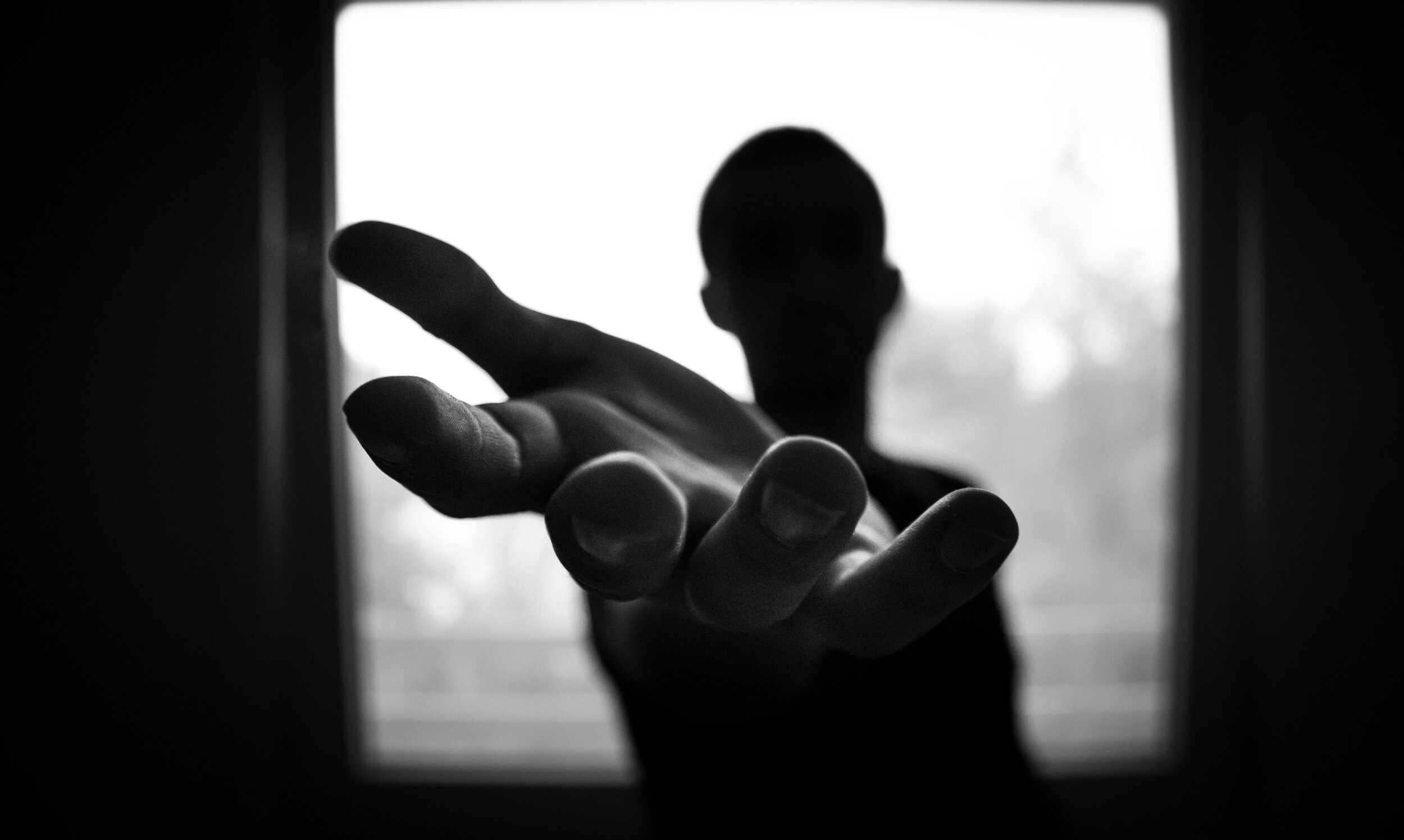 man s hand in shallow focus and grayscale photography 167964
