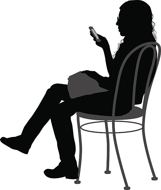Vector silhouette of a siting in a chair while using her smart phone.